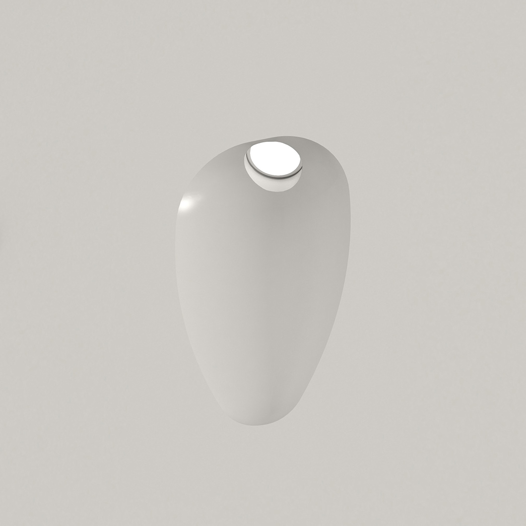 Nama Fos 14 Wall Light recessed and plastered into a plain grey wall, light switched on