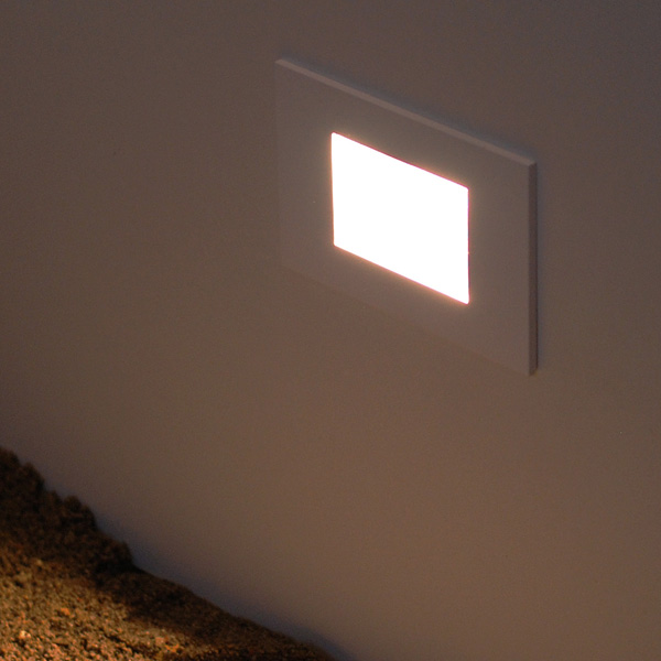 Outdoor Low Level Lights: Rectangular LED low level light recessed into a wall & shining onto the ground