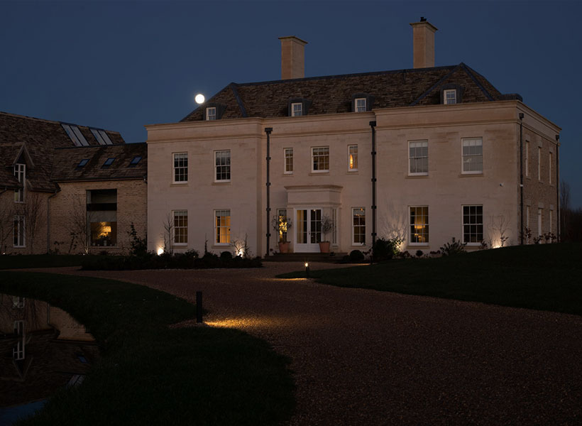 Project Portfolio: exterior of huge country home & grounds at night