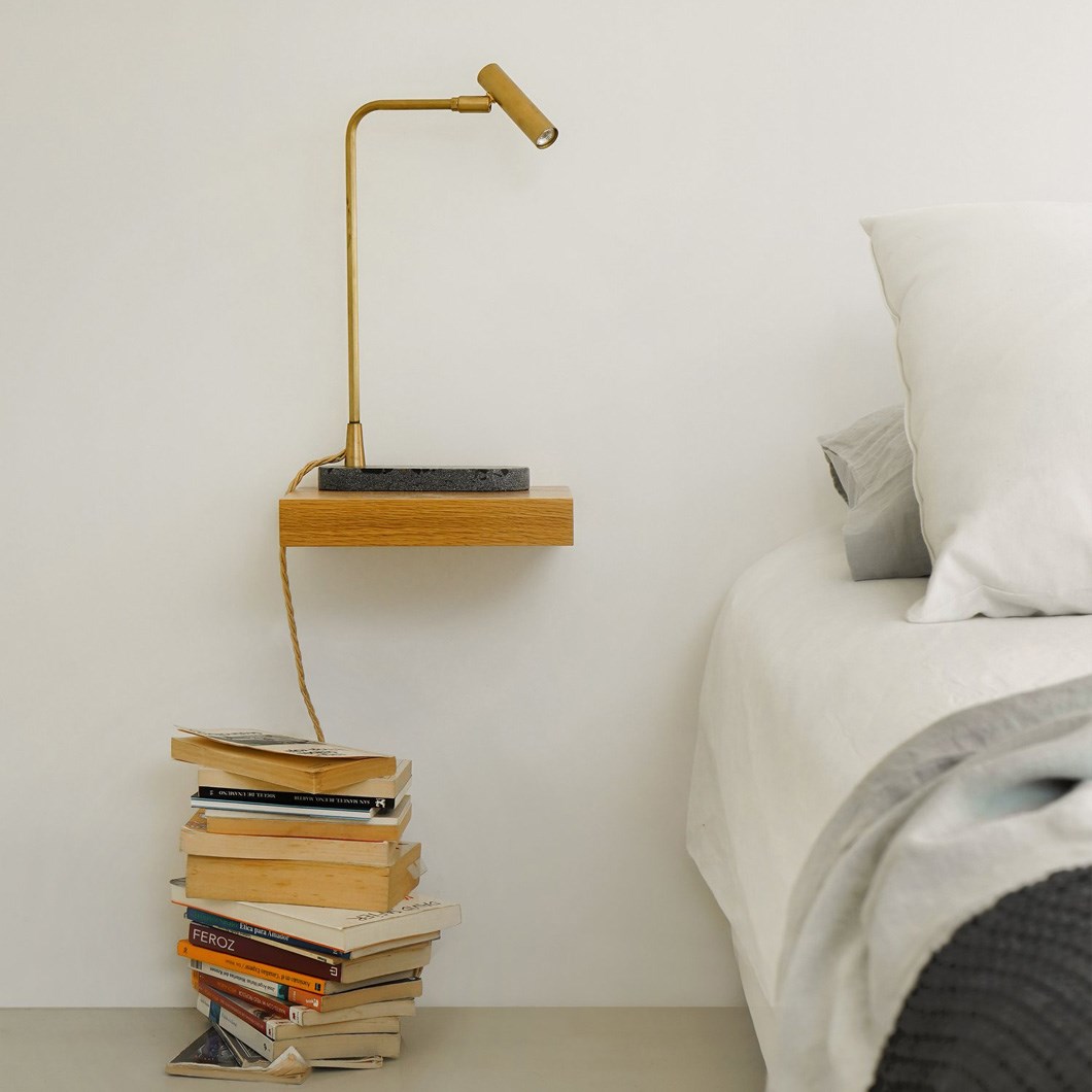 Contain Book Table Light with brushed brass finish and black terrazo stone base