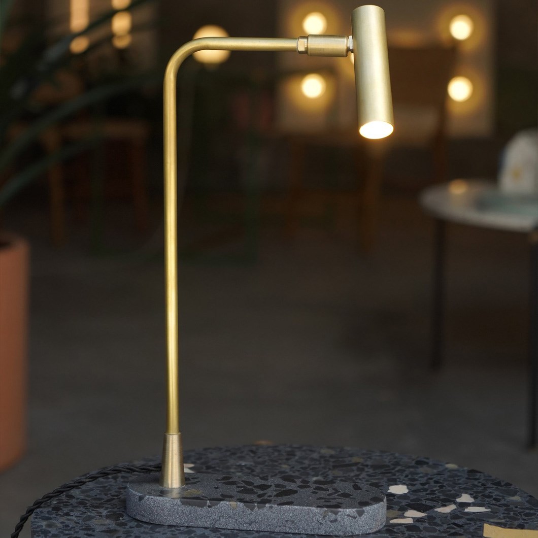 Contain Book Table Light with brushed brass finish and black terrazo stone base 