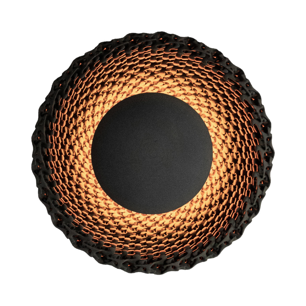 Round wall light made from black quartz sand